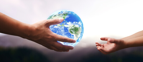 Wall Mural - man giving the world to new generations - Elements of this image furnished by NASA
