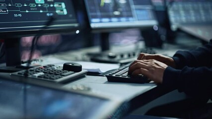 Close Up of a Professional Office Specialist Working on Desktop Computer in Modern Technological Monitoring Control Room with Digital Screens. Manager Typing on keyboard and Using Mouse.
