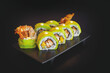 Sushi roll with soft shell crab, wrapped in thinly sliced avocado
