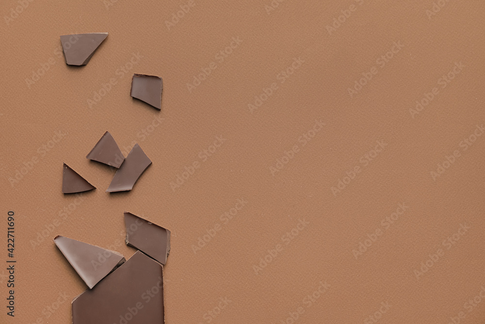 Composition with chocolate on color background