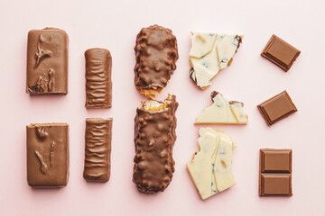 Wall Mural - Composition with different chocolate on color background