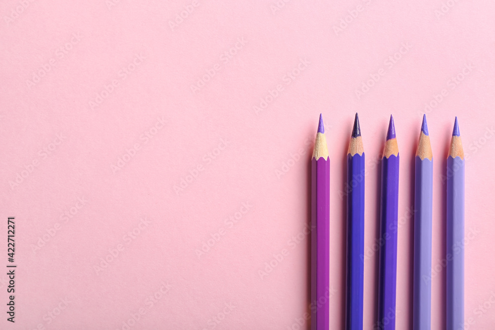 Set of pencils on color background