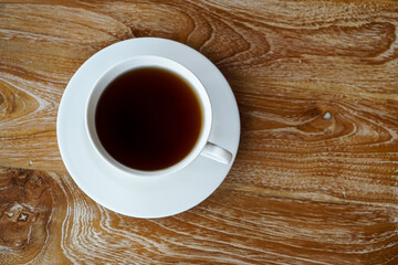 A glass of warm tea on the table