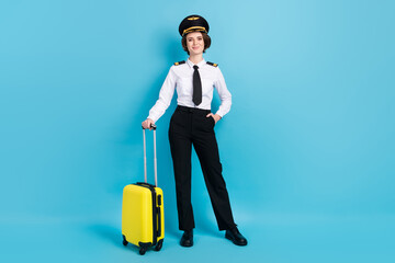 Poster - Full size photo of optimistic nice brunette hair lady carry bag wear pilot uniform isolated on blue color background