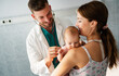 © NDABCREATIVITY - Mother holding baby for pediatrician doctor to examine