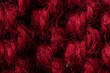 Leinwandbild Motiv Knitted background of red, burgundy, wine color. Knitted texture. Knitting pattern from wool. Winter clothes, scarf, close-up. Wallpaper, macro
