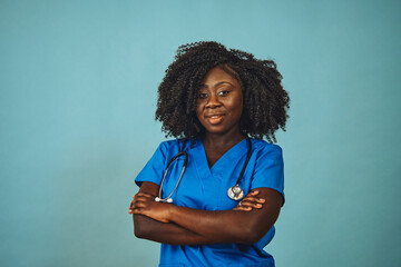 Female doctor with arms crossed looking ahead