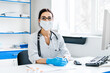 © Тарас Нагирняк - Female doctor in a protective mask with a stethoscope is waiting for her patient, she is looking at the camera, a professional, health modern medicine