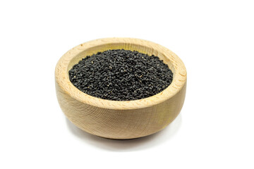 Wall Mural - Real black cumin in wooden bowl isolated on white background