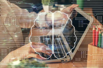 Double exposure of woman hands working on computer and brain hologram drawing. Ai concept.