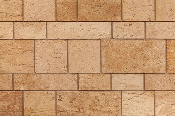 Wall Mural - Building exterior brown granite block wall texture and background seamless