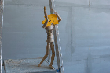 Wall Mural - Wooden man with sad drawn face on the ladder.