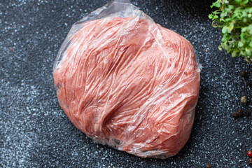 Wall Mural - frozen minced meat portion in a plastic bag long-term storage of food portion on the table healthy meal top view copy space for text food background rustic image