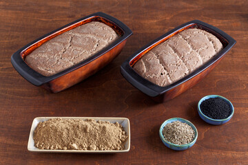 Homemade bread with acorn flour. Two loafs of freshly baked bread at home in clay natural moulds.