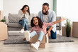 © Prostock-studio - Happy black family celebrating moving day in new flat