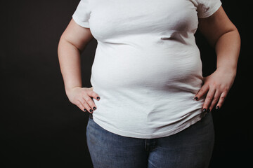 Wall Mural - Fat people. Overweight woman at studio background