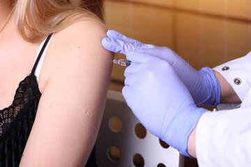 Vaccination point - the nurse vaccinates the patient against the coronavirus