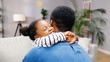 © VAKSMANV - Close up of African American adorable cute little girl hugging her father in room at home in good mood. Rear of male parent embracing small daughter kid spending time together. Child concept