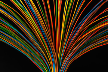 Sticker - Colored electrical cable wire on black background