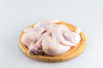 raw chicken carcass on the cutting board isolated on white background