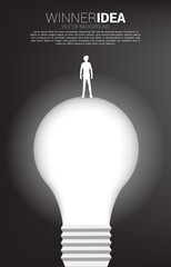 Poster - Silhouette of businessman standing on light bulb . Business Concept of creative idea and solution.