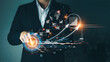© Thapana_Studio - Concept of startup business to be successful, Businessman touch tablet screens, business icons and network connections on global modern interface.
