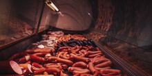 Refrigerated Counter Filled With Quantity And Different Sausages