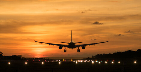 Silhouette Airplane will take-off at an airport during sunset sky