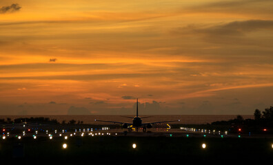  An airplane will take-off at an airport during sunset sky   