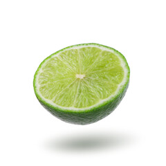 Wall Mural - Half with slice of fresh green lime isolated on white background