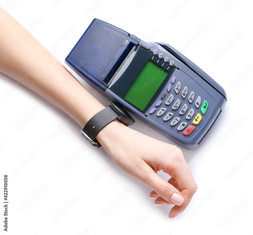 Female hand with smart watch and payment terminal on white background