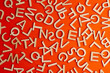 wooden cut alphabet letters on orange background