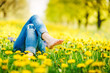 © olyphotostories - Relaxing girl lying in a meadow in summer sunshine