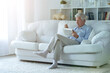 © aletia2011 - Senior man reading newspaper  at home