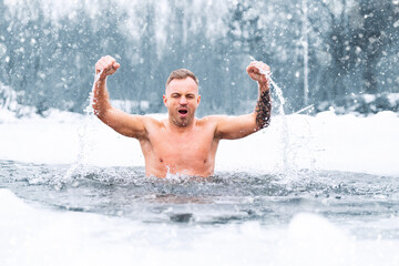 Man winter swimming in ice cold water