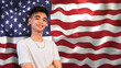 © Mdv Edwards - A proud young Asian American man, in front of a waving US flag.