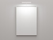 © Alex Celaire - empty A4 frame on white wall with spotlights