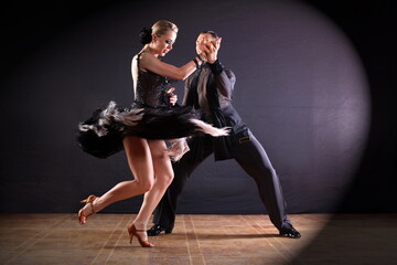 Wall Mural - Dancers in ballroom isolated on black background