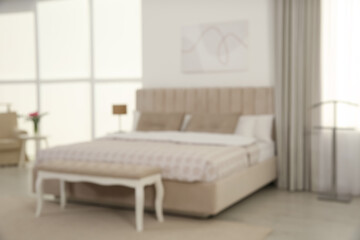 Sticker - Blurred view of stylish hotel bedroom interior with modern furniture