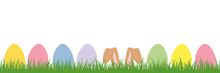Hare Ears In The Meadow Between Colorful Easter Eggs