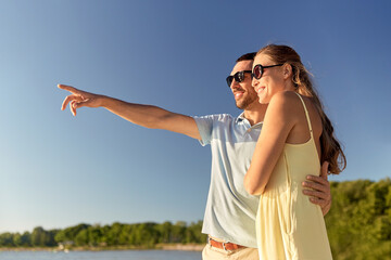 Wall Mural - happy couple hugging on summer beach