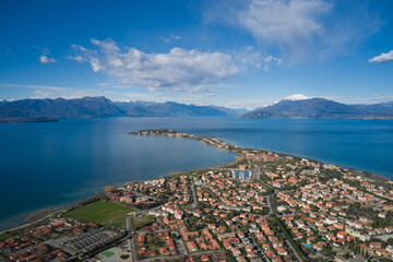 High altitude panorama of Sirmione city, Colombare, Italy. Sirmione winter aerial view. Aerial panorama of Lake Garda. Italian resorts Lake Garda aerial view.