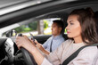 © Syda Productions - car driving school instructor teaching woman