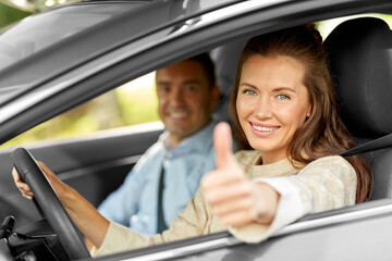 Wall Mural - car driving instructor and woman showing thumbs up