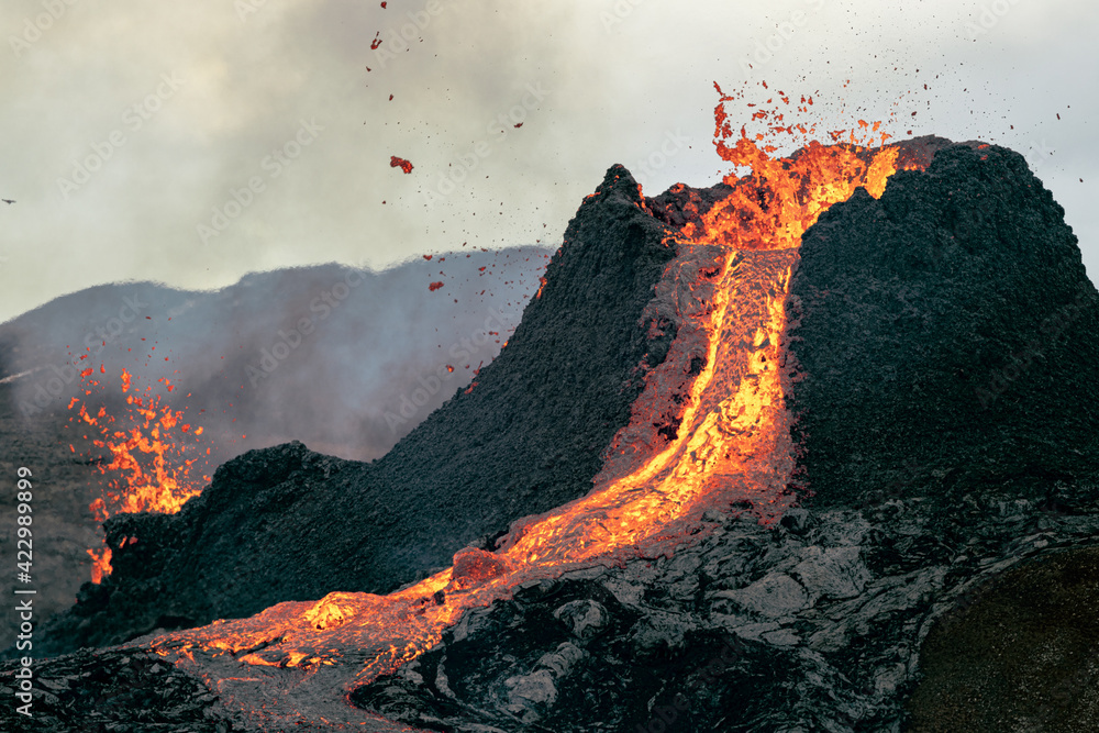 Hot lava is erupting from the volcano in Iceland in March 2021.
 - obrazy, fototapety, plakaty 