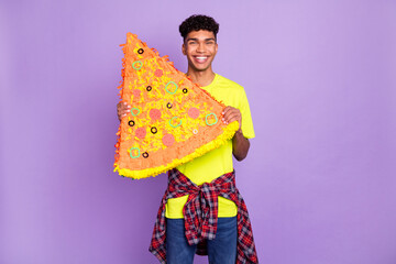 Sticker - Photo portrait of young curly guy holding paper collage of pizza hungry waiting for delivery isolated on pastel violet color background