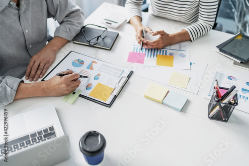 Obraz Dibond Startup business people teamwork calculating a valuation in workplace..