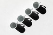 © Andrey - Coffee concept - four empty diagonal coffee cups with hard shadows