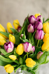  Background: a bouquet of purple tulips on gray, the concept of spring, holiday, mother's day.