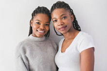 Mother And Her Teenage Daughter On White